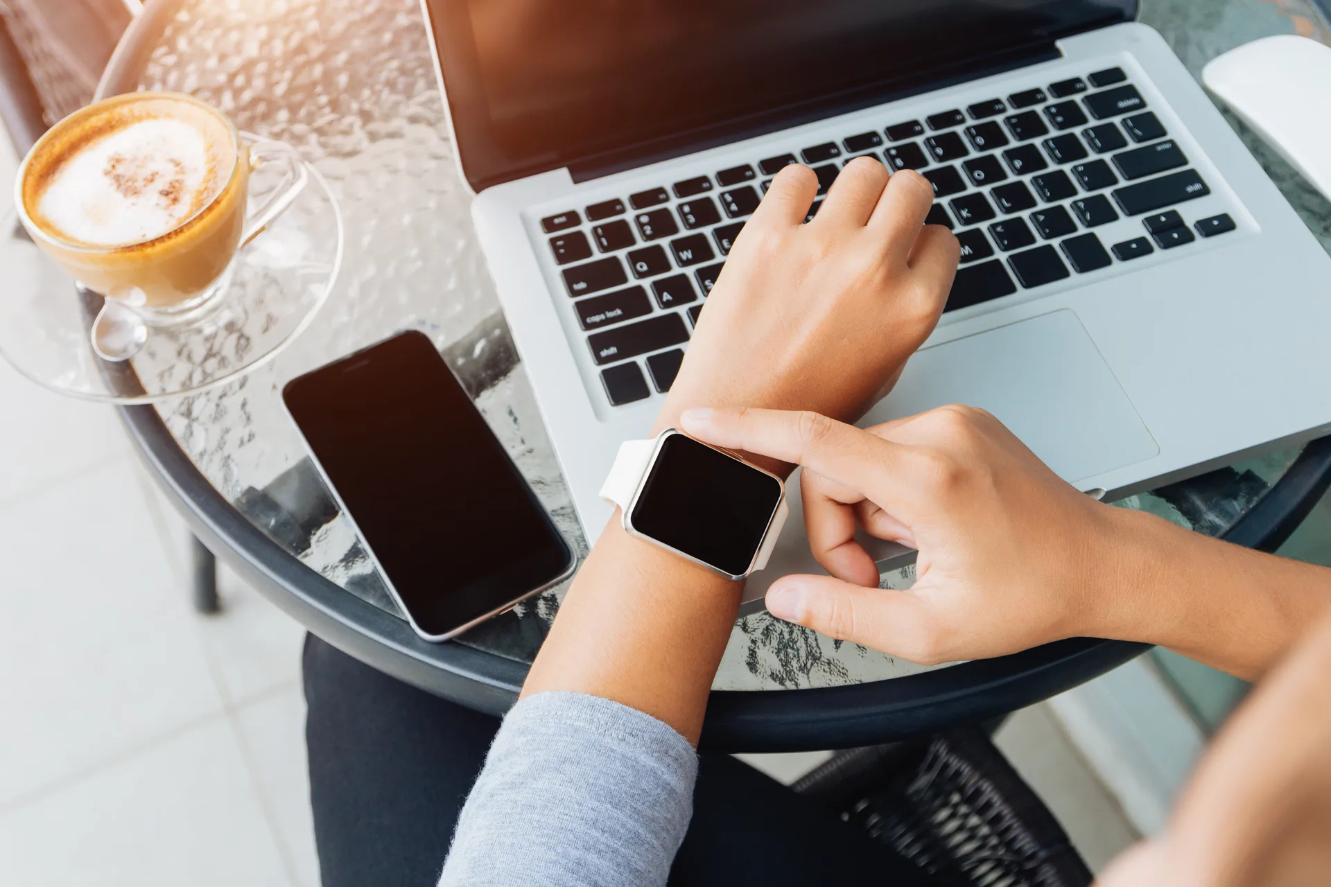 Apple Watch and MacBook at work
